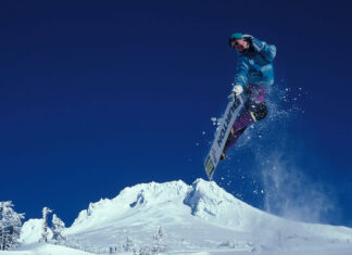 Kim Kardashian Shows Off Deep Cleavage In Plunging Top & Mini